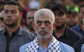 Head of the political wing of the Palestinian Hamas movement in the Gaza Strip Yahya Sinwar attends a rally in support of Jerusalem's al-Aqsa mosque in Gaza City on October 1, 2022. (Photo by MAHMUD HAMS / AFP)