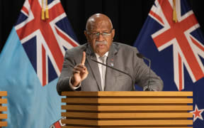 Fiji Prime Minister Sitiveni Rabuka talks to journalists at New Zealand's Parliament.