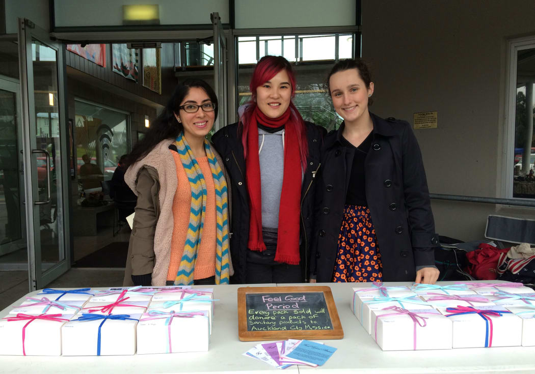 Nikita Kapoor (L) and Sacha Baillie (R) of Feel Good Period, with Bevan Chuang (C) at the Wesley Market.