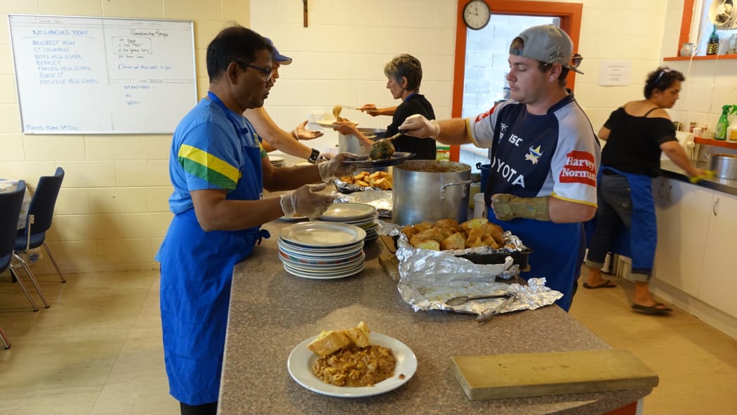 Volunteers serve up lunch at St Vincent de Paul's in Hamilton. The agency is handing out double the number of food parcels each month compared to 2016.