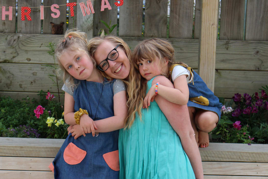Dr Eva Neely with her daughters.