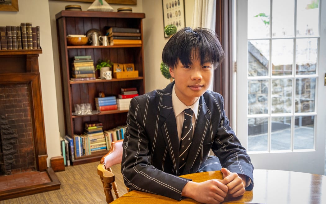 Image of Bill Li sitting at a table.