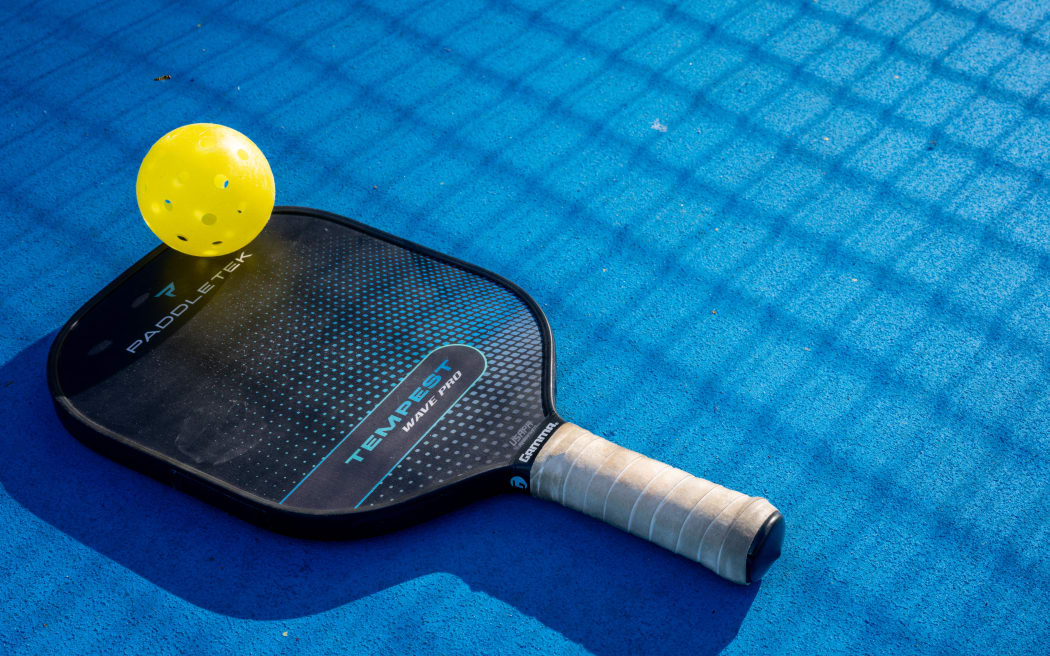 Pickleball paddle and playing ball