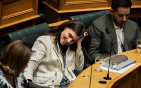 Chloe Swarbrick reacts to Christopher Luxon in the House