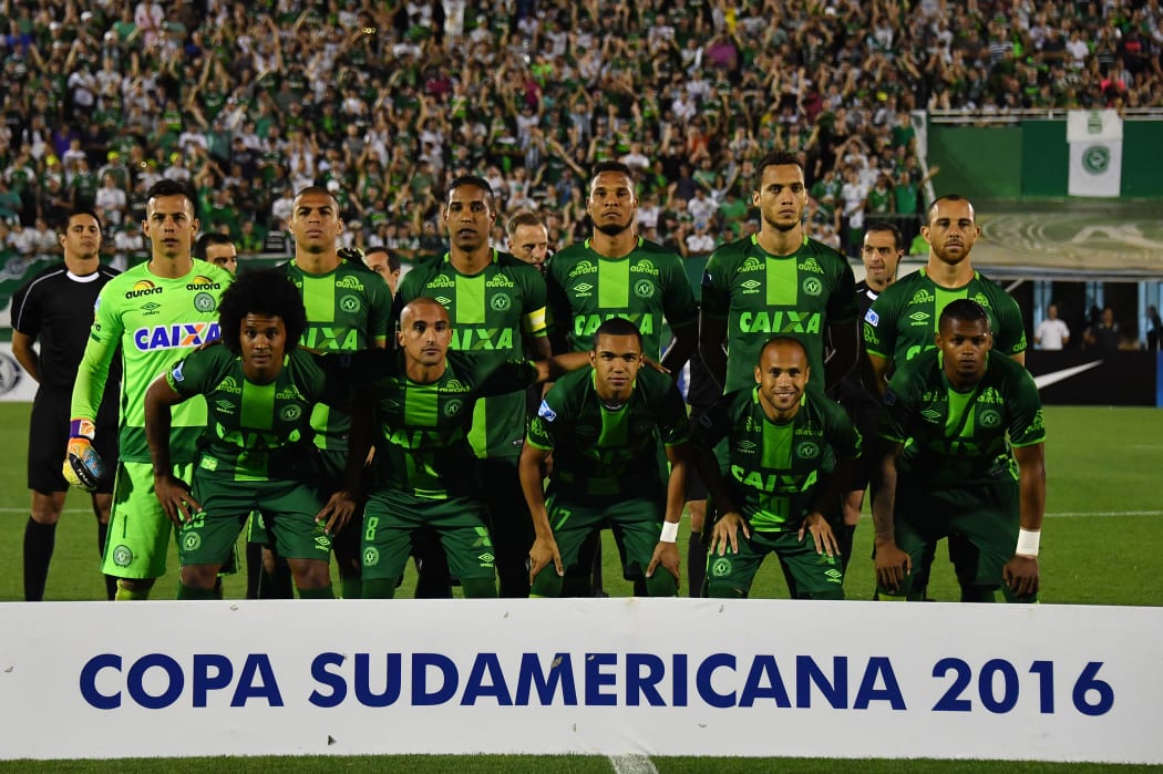 This file photo taken on November 24, 2016 shows Brazil's Chapecoense players posing for pictures during their 2016 Copa Sudamericana semifinal second leg football match against Argentina's San Lorenzo held at Arena Conda stadium, in Chapeco, Brazil.