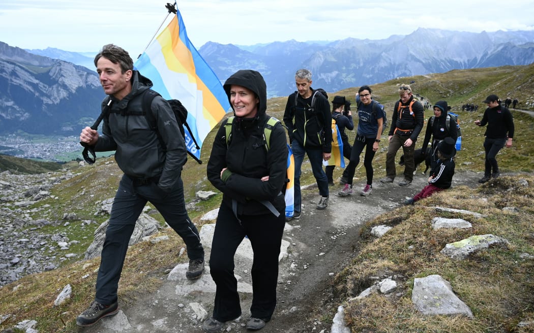 People take part in a ceremony to mark the 'death' of the Pizol glacier (Pizolgletscher) on September 22, 2019 above Mels, eastern Switzerland.