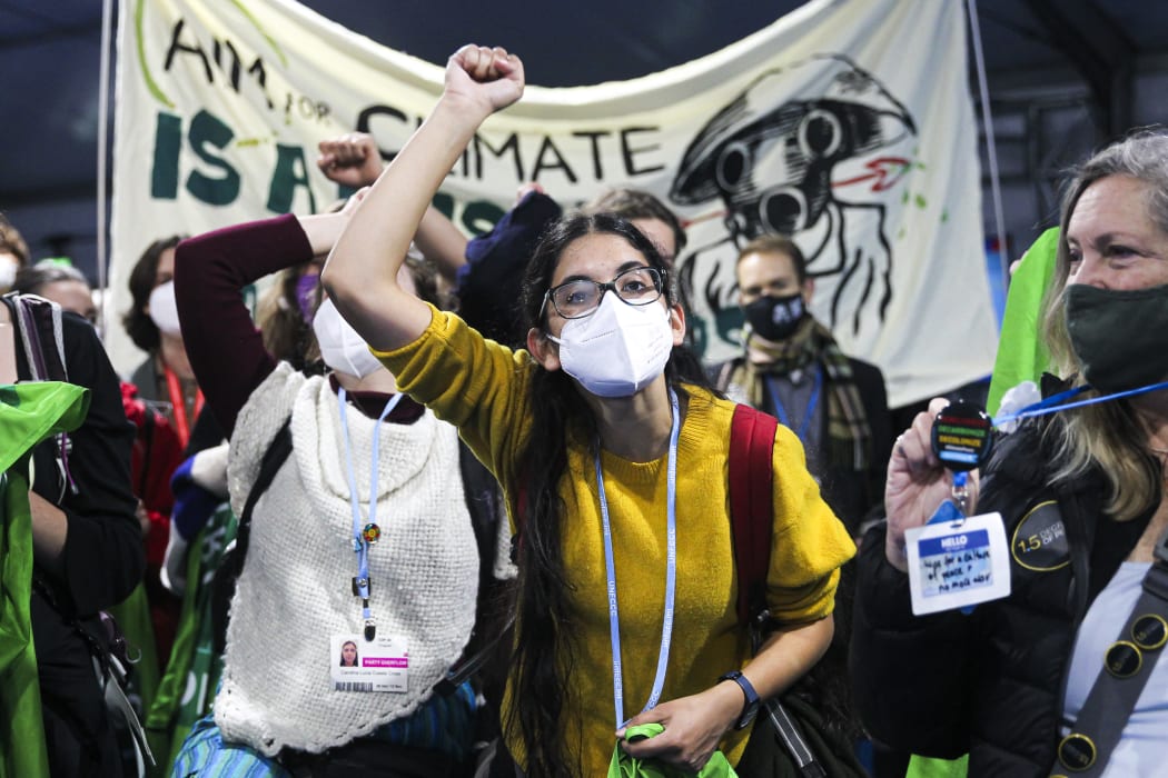 Climate activists and delegates stage a walk out in protest of the ongoing negotiations yesterday.