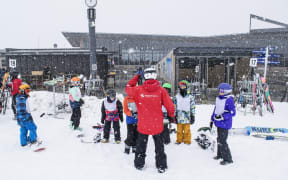 Children playing on Coronet Peak.