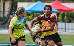 PNG Palais captain Joanne Lagona takes on the Australian defence.