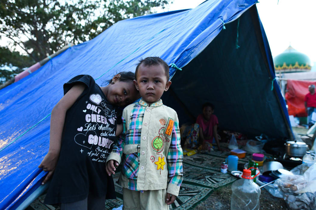 Tents have been set up on a field of a mosque for people to take refuge in Palu, Indonesia's Central Sulawesi.