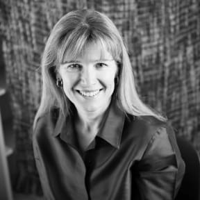 Visiting health fellow Amy Downs says New Zealand should have no more than six DHBs