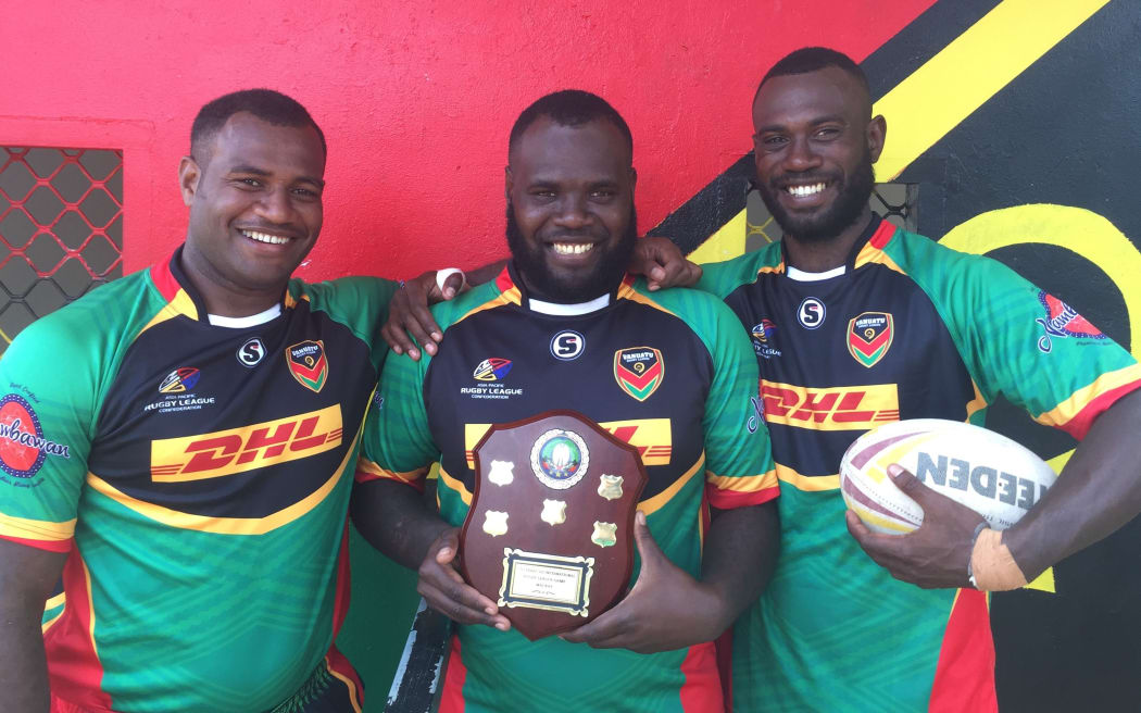 Brothers and Vanuatu teammates Ben Lui (left), Tonny Lui (middle) and Danford Lui (right) with the Vanuatu and Solomon Islands Trophy.