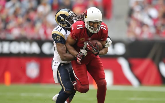 Arizona Cardinals wide receiver Larry Fitzgerald (11) tries to run after a catch.