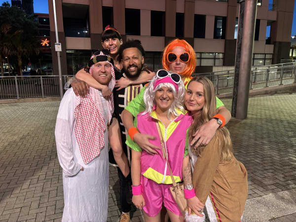 Six people in colouful costumes.