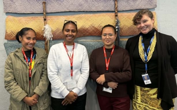 Earth Science New Zealand Pacific strategy and engagement advisor Molly Powers-Tora (right) with the three Pacific Island students (from left) Florence Townshend (Solomon Islands), Jessica Maoh (Vanuatu) and Ueakeia Tofinga (Kiribati). Photo: Iliesa Tora/RNZ Pacific