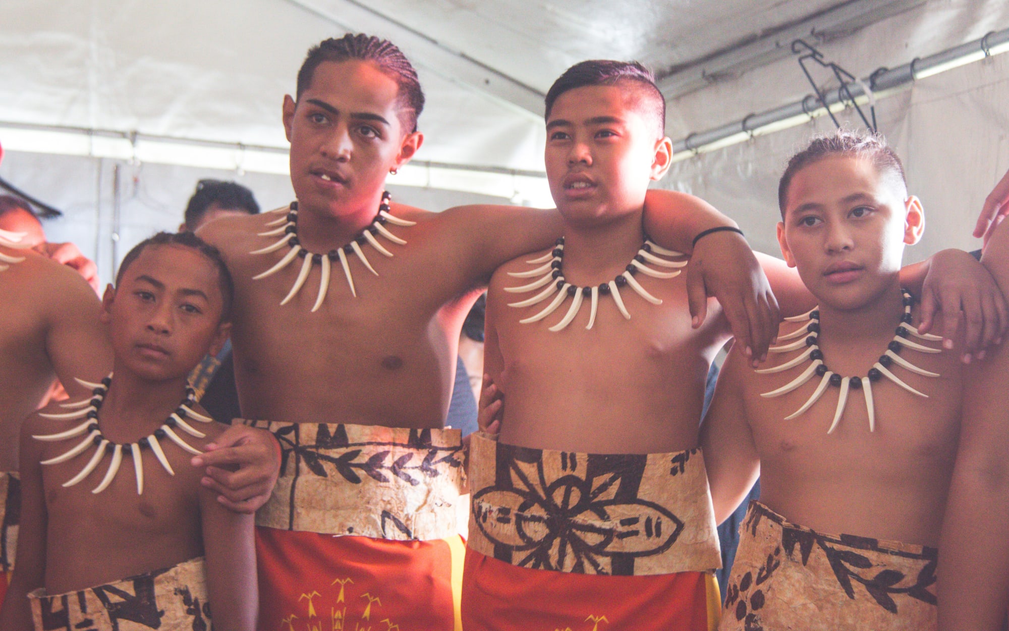 St Paul's College Samoan group students huddle backstage, just before they compete at Polyfest