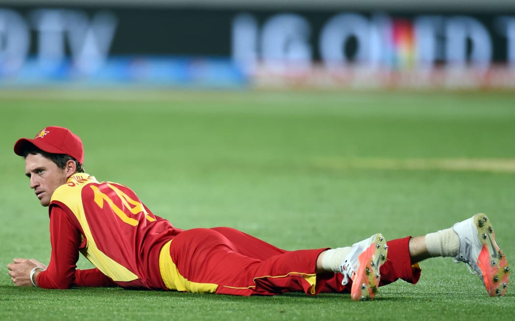 Zimbabwe fielder Sean Williams ruing the mistake of his misfield at gully during the ICC Cricket World Cup match between India and Zimbabwe at Eden Park in Auckland, New Zealand. Saturday 14 March 2015. Copyright Photo: Raghavan Venugopal / www.photosport.co.nz