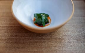 Tomato over embers by Ed Verner