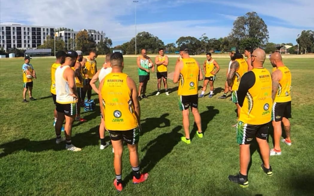 Cook Islands rugby league coach Tony Iro (top centre) issues instructions during training.
