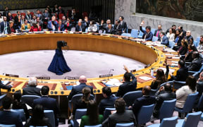 Ambassadors vote during a meeting about the situation in the Middle East, including the Palestinian question, at UN headquarters in New York on December 22, 2023. The Security Council was expected to vote December 22 on a resolution to boost aid to Gaza, as the world body warned the Israel-Hamas war was pushing the Palestinian territory towards famine. (Photo by Charly TRIBALLEAU / AFP)