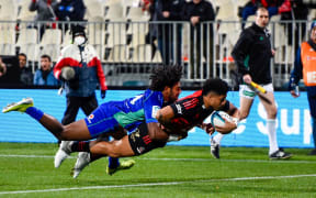 Leicester Faingaanuku of the Crusaders scores a try in the tackle of  Selestino Ravutaumada of Fijian Drua during the Super Rugby Pacific match, Crusaders Vs Fijian Drua, at Orangetheory Stadium, Christchurch, New Zealand, 20th May 2022. Copyright photo: John Davidson / www.photosport.nz