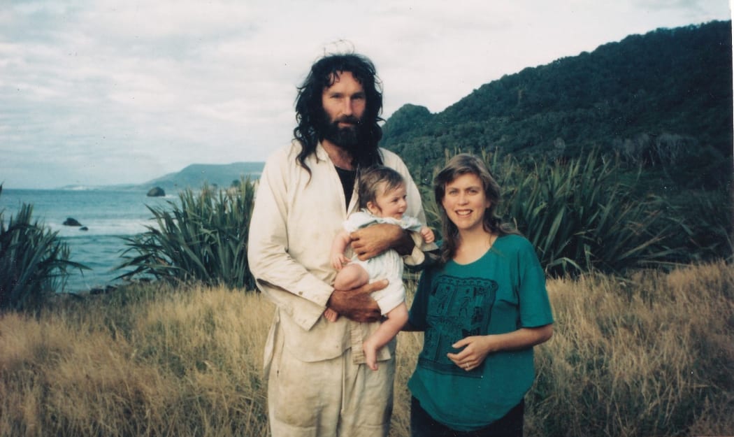 Baby Chris with his parents Robert Long and Catherine Stewart in 1992, at the end of the airstrip at Gorge River.