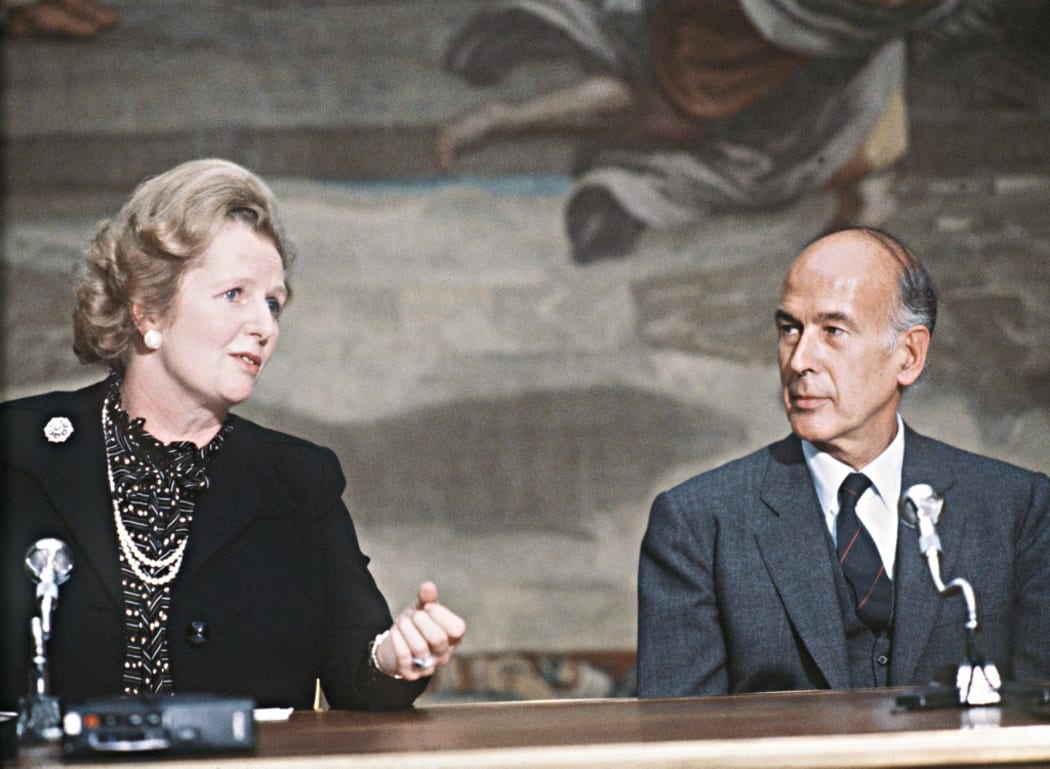 (FILES) This file photo taken on September 19, 1980 shows then Britain Prime Minister Margaret Thatcher talking with then French President Valery Giscard d'Estaing during the 5th France-Britain summit at the Elysee Palace in Paris.