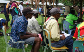 Scrutineers watch polling during the Papua New Guinea national election 2017.