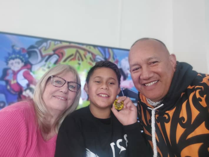 Charlie Ross-Matenga, 11, (centre) with mum, Sue Kara, and dad Patrick Kara.