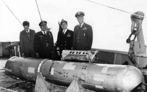 The B28RI nuclear bomb, recovered from 2,850 feet (870 m) of water, on the deck of the USS Petrel.