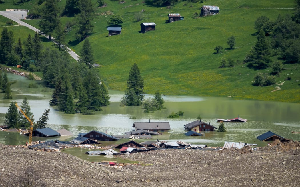 This photograph shows the small village of Blatten, in the Bietschhorn mountain of the Swiss Alps, destroyed by a landslide after part of the huge Birch Glacier collapsed and swallowed up by the river Lonza the day before, in Blatten on May 29, 2025. Swiss authorities were on May 29, 2025 monitoring for possible flood risk in a southern valley, following a massive glacier collapse that created a huge pile of debris after destroying a small village. On May 28 the Birch glacier in Switzerland's southern Wallis region collapsed, sending tons of rock, ice and scree hurtling down the mountain slope and into the valley below. The barrage largely destroyed the hamlet of Blatten, which had been home to 300 people and was evacuated last week due to the impending danger. (Photo by FABRICE COFFRINI / AFP)