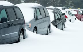 Rental cars covered with snow at Dulles international airport in Virginia.