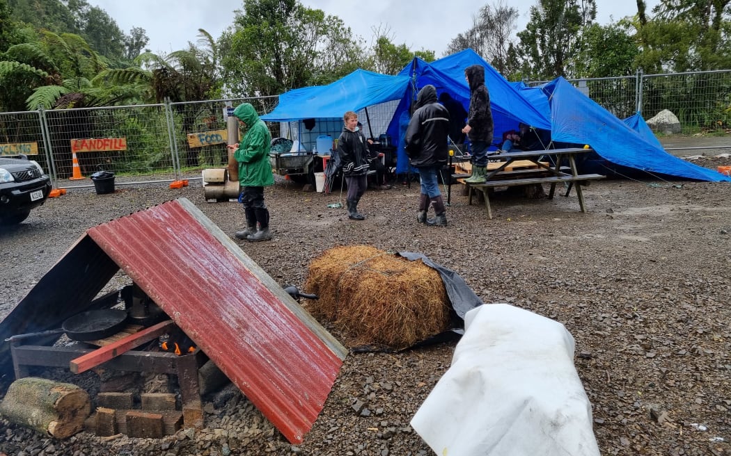About 20 protesters who believe Mt Messenger is being desecrated have set up camp at its summit.