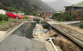Flooding gouged holes in the road at Devenish Place, Nelson.