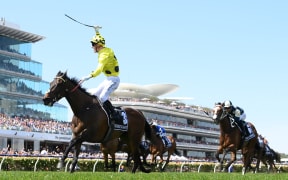 MELBOURNE, AUSTRALIA - NOVEMBER 07: Mark Zahra riding Without a Fight wins the Lexus Melbourne Cup during Melbourne Cup Day at Flemington Racecourse on November 07, 2023 in Melbourne, Australia. (Photo by Quinn Rooney/Getty Images)