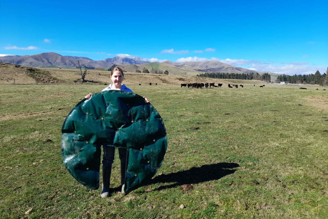 Amy Hay holds a FrostEase Flexi-Mat
