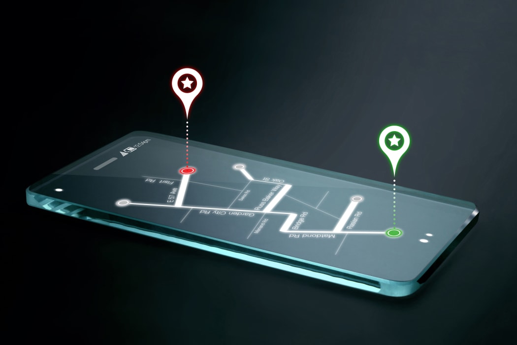 Map and navigation icons on transparent smartphone screen. GPS or Global Positioning System is a network of orbiting satellites that send precise details of their position in space back to earth.
