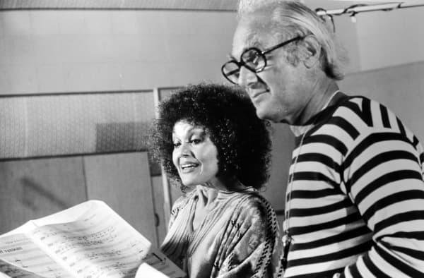 Cleo Laine, the jazz singer performing in the studio, with the producer Norman Granz who produced the recording of the George Gershwin folk opera, Porgy and Bess, Los Angeles, California, September 25, 1976. (Photo by Afro American Newspapers/Gado/Getty Images)