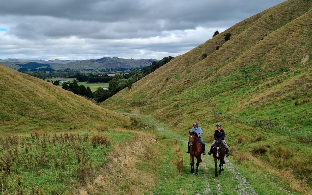 Olympians Sally Clark and Maurice Beatson riding on their farm near Dannevirke.