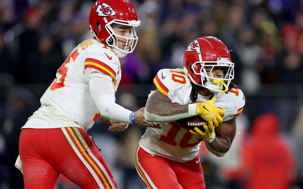 Patrick Mahomes #15 of the Kansas City Chiefs hands off to Isiah Pacheco #10 during the third quarter against the Baltimore Ravens in the AFC Championship Game.