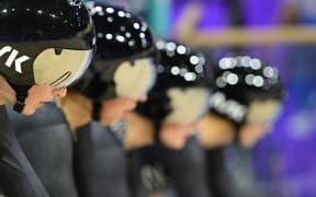 New Zealand's Ally Wollaston, New Zealand's Bryony Botha, New Zealand's Emily Shearman and New Zealand's Nicole Shields prepare to compete in a women's track cycling team pursuit qualifying round of the Paris 2024 Olympic Games at the Saint-Quentin-en-Yvelines National Velodrome in Montigny-le-Bretonneux, south-west of Paris, on August 6, 2024. (Photo by John MACDOUGALL / AFP)