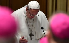 Pope Francis prays during the opening of a global child protection summit at the Vatican on 21 February 2019.