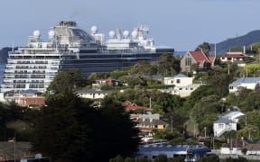 Cruise ship 'Majestic Princess' looms behind the houses of Port Chalmers as it leaves Dunedin on 4 November 2022.