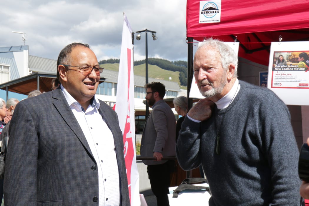 Adrian Rurawhe, at left, speaking to voters in Waikanae