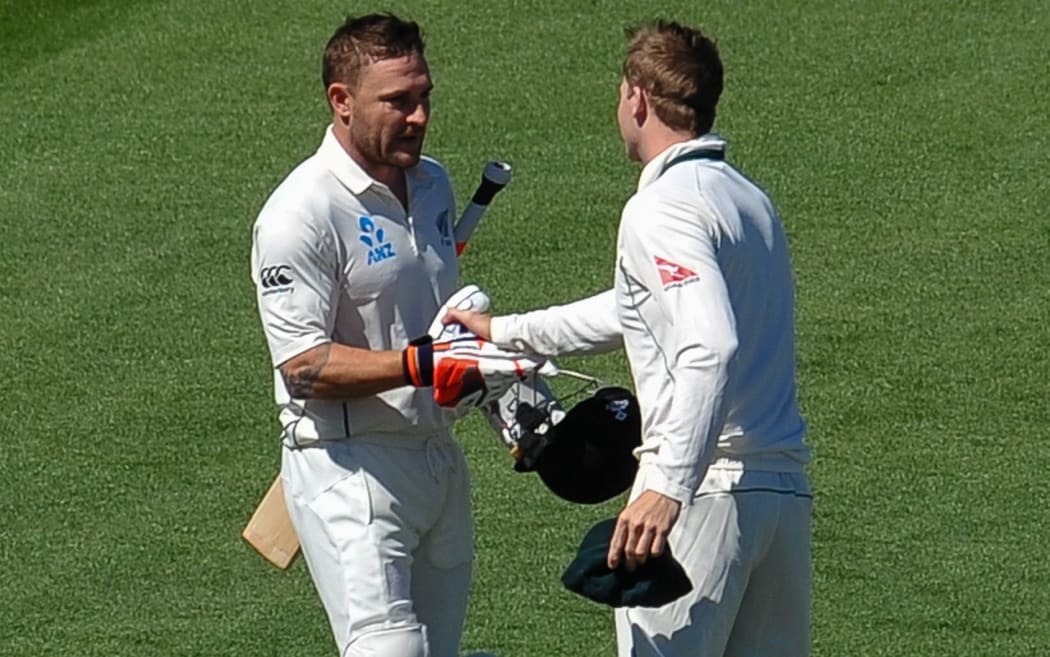 Brendon McCullum is welcomed to the crease by Australian captain Steve Smith.