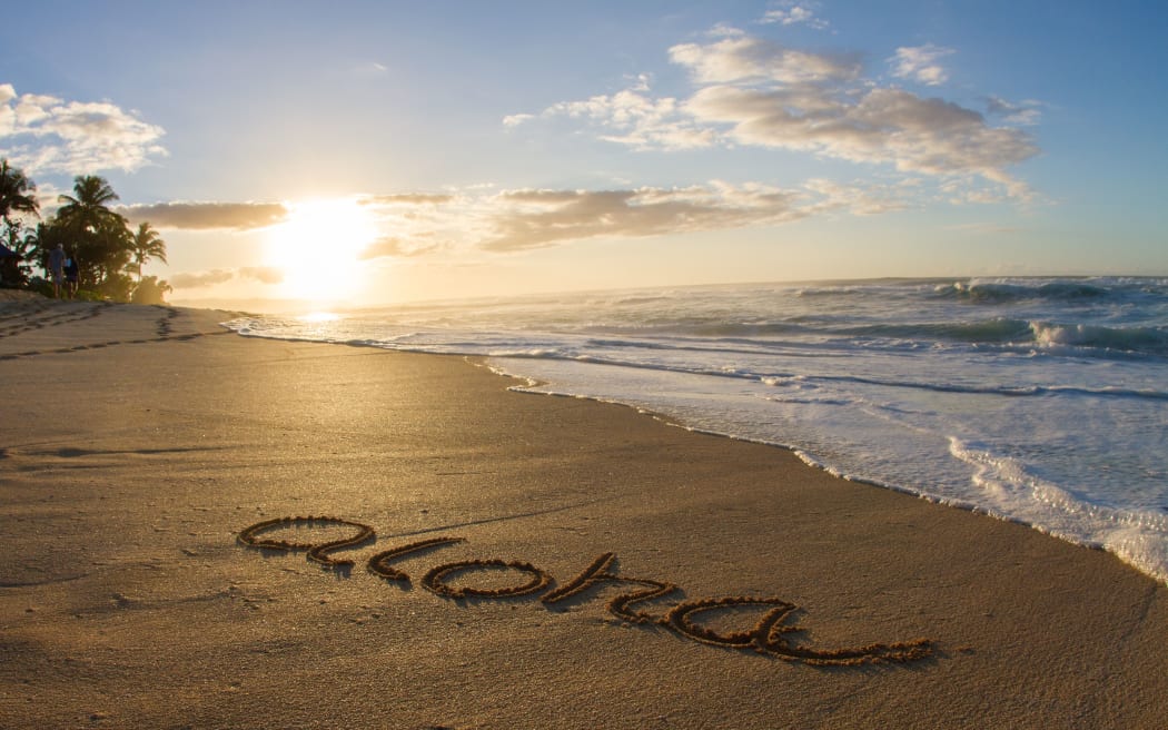 Aloha, written in the sand on beach, Hawaii