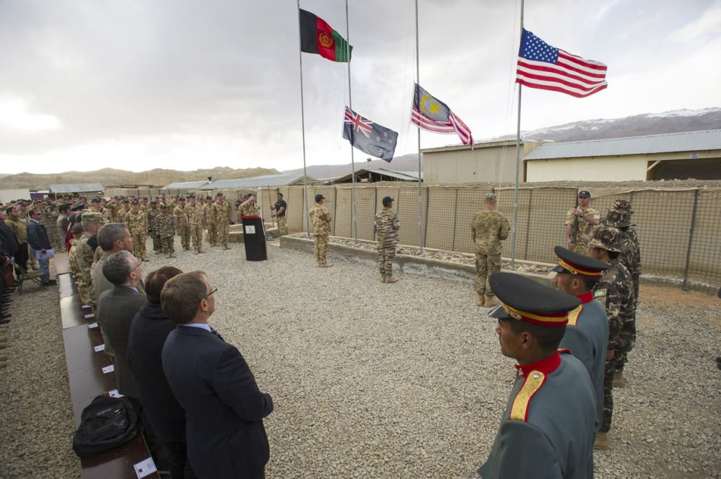 The New Zealand flag is lowered at the end of the ceremony.