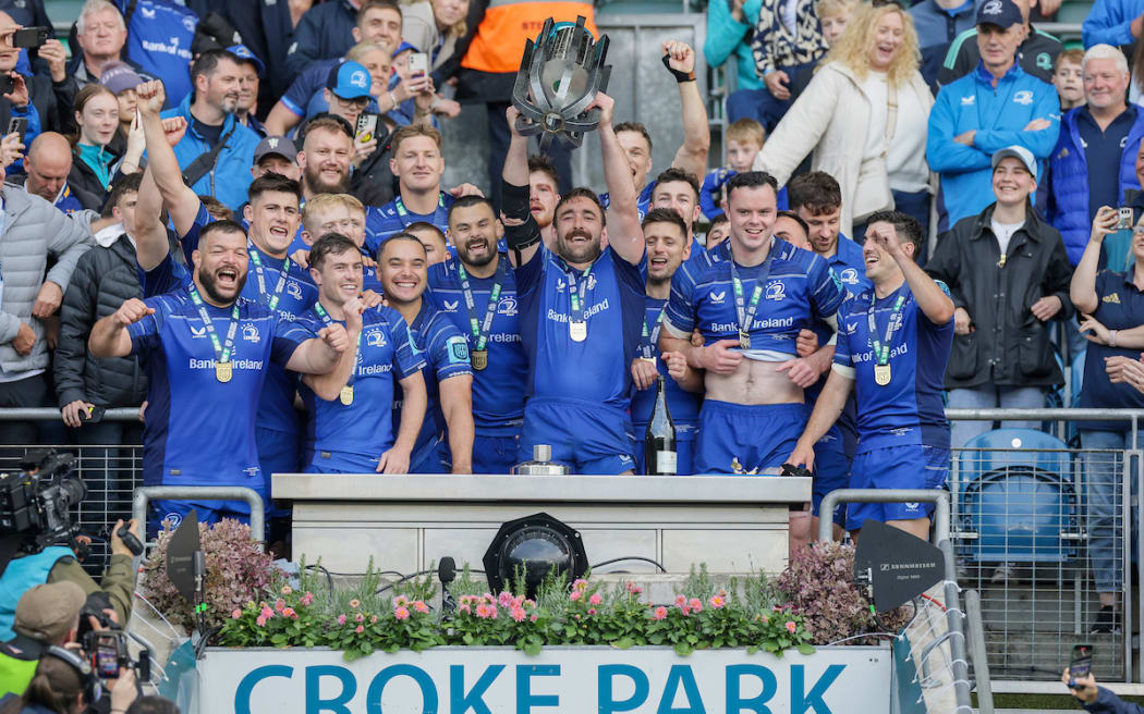 Leinster's Jack Conan lifts the URC trophy.