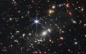 In this handout photo from NASA obtained on July 11, 2022, the first infrared image from the James Webb Space Telescope (JWST) is seen. - The JWST is the most powerful telescope launched into space and it reached its final orbit around the sun, approximately 930,000 miles from Earths orbit, in January, 2022. The technological improvements of the JWST and distance from the sun will allow scientists to see much deeper into our universe with greater detail. (Photo by Handout / NASA / AFP) / RESTRICTED TO EDITORIAL USE - MANDATORY CREDIT "AFP PHOTO / NASA" - NO MARKETING NO ADVERTISING CAMPAIGNS - DISTRIBUTED AS A SERVICE TO CLIENTS