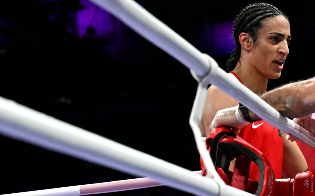 Algeria's Imane Khelif watches during her women's 66kg preliminaries round of 16 boxing match against Italy's Angela Carini during the Paris 2024 Olympic Games at the North Paris Arena, in Villepinte on August 1, 2024. (Photo by MOHD RASFAN / AFP)